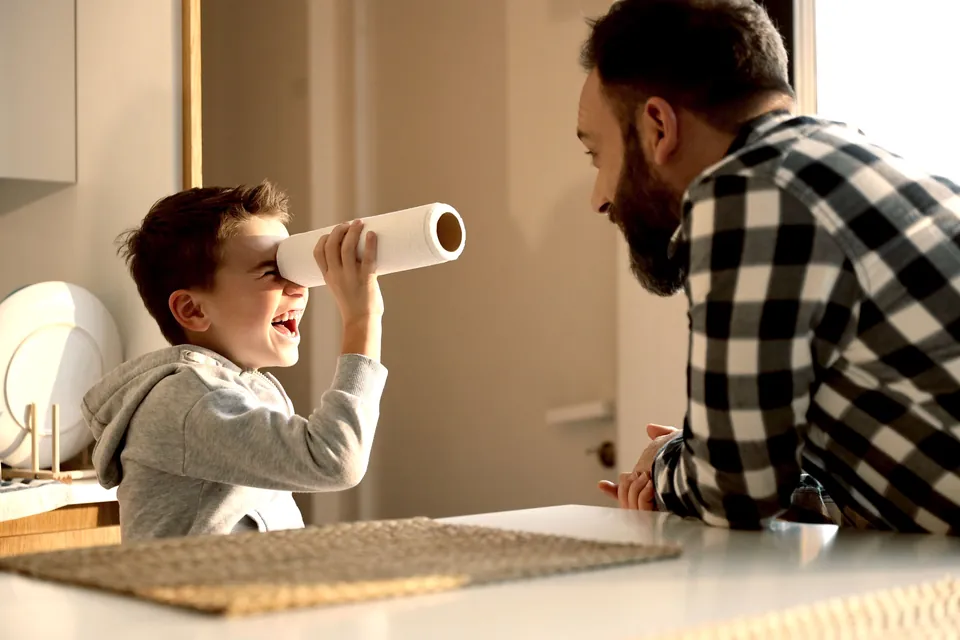 A father and son playing together